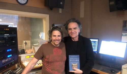 Peter Buffett and Jimmy Buff pose with David Fleming's Surviving the Future